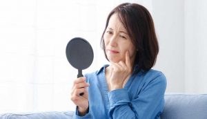 woman-looking-into-mirror